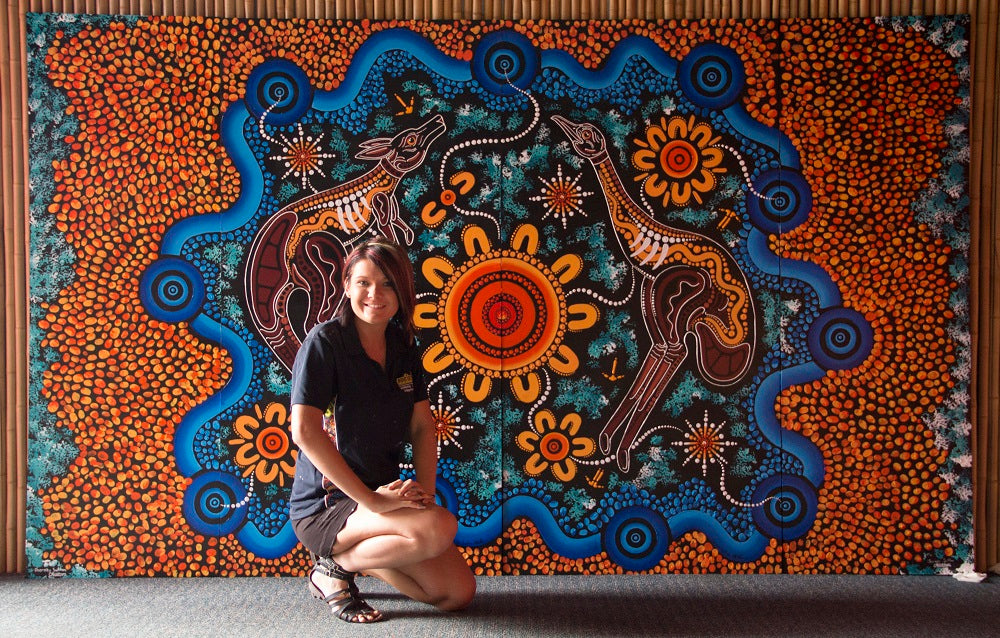 Chern'ee Artist in Residence at Dreamworld on the Gold Coast Painting a Memorial