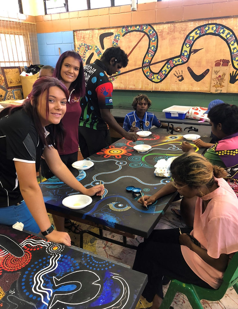 Chern'ee and Brooke Sutton Hold a Painting Workshop in Woorabinda with the Local Police and Children