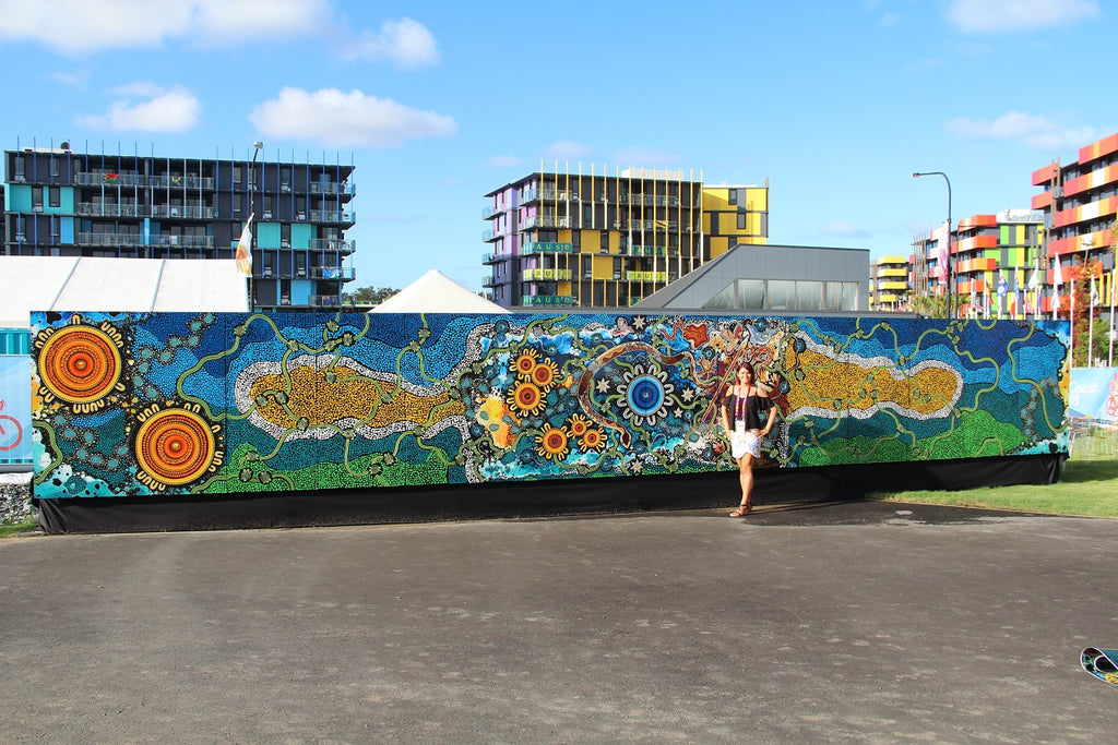 Chern'ee's 14 metre painting called "Journey To Gold" goes on Display for the Commonwealth Games