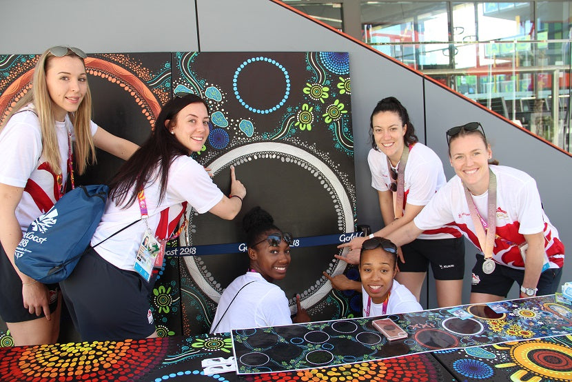 The Commonwealth Games Silver Medal Winners add their Fingerprints to Chern'ee's Painting